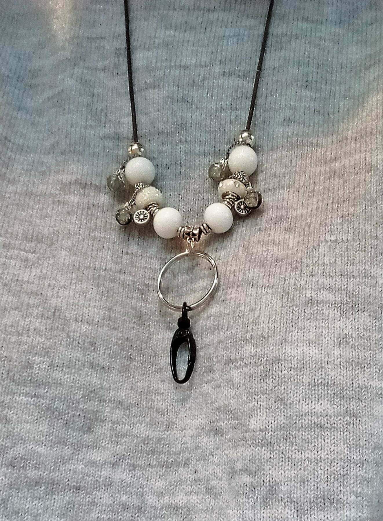 Black, white, silver beads, leather cord